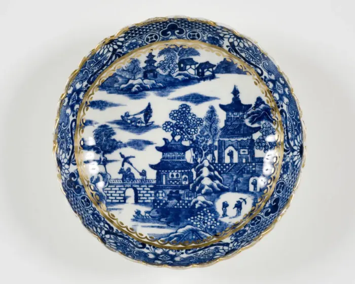 Framed Print : Saucer made from porcelain, transfer-printed in underglaze blue with the Framed Print : Saucer made from porcelain, transfer-printed in underglaze blue with the