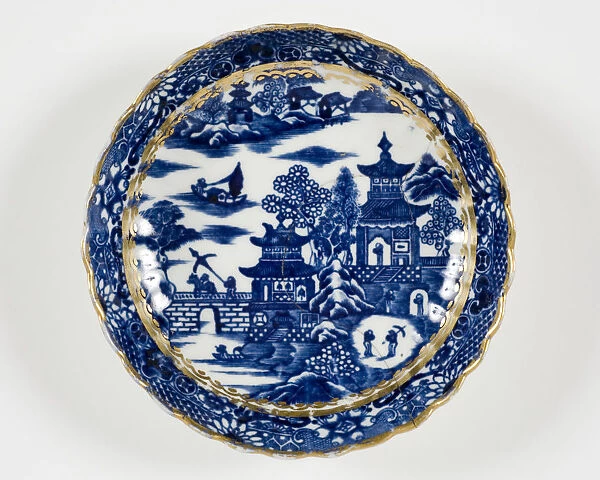 Saucer made from porcelain, transfer-printed in underglaze blue with the