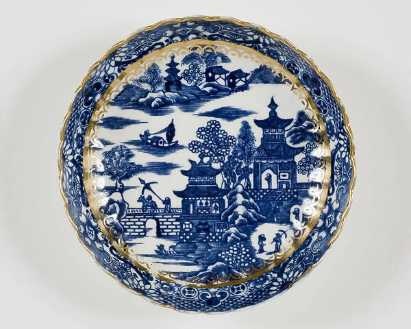 Saucer made from porcelain, transfer-printed in underglaze blue with the