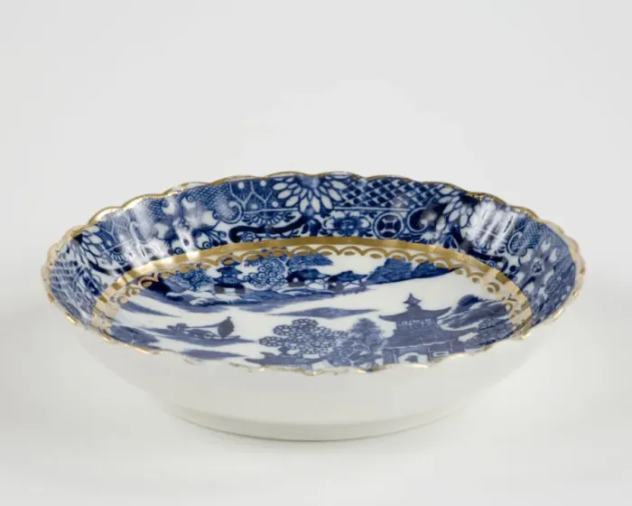 Framed Print : Saucer made from porcelain, transfer-printed in underglaze blue with the Framed Print : Saucer made from porcelain, transfer-printed in underglaze blue with the