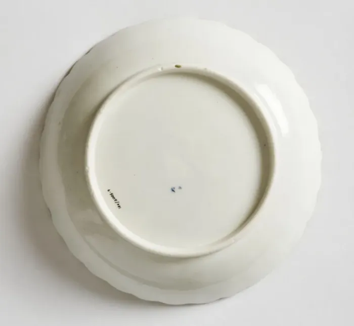 Framed Print : Saucer made from porcelain, transfer-printed in underglaze blue with the Framed Print : Saucer made from porcelain, transfer-printed in underglaze blue with the