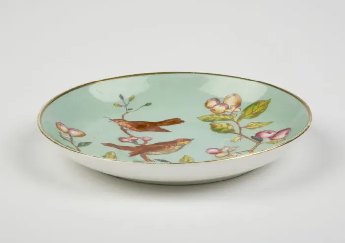 Framed Print : Saucer made from glazed hard-paste porcelain, decorated with a transfer-printed Framed Print : Saucer made from glazed hard-paste porcelain, decorated with a transfer-printed