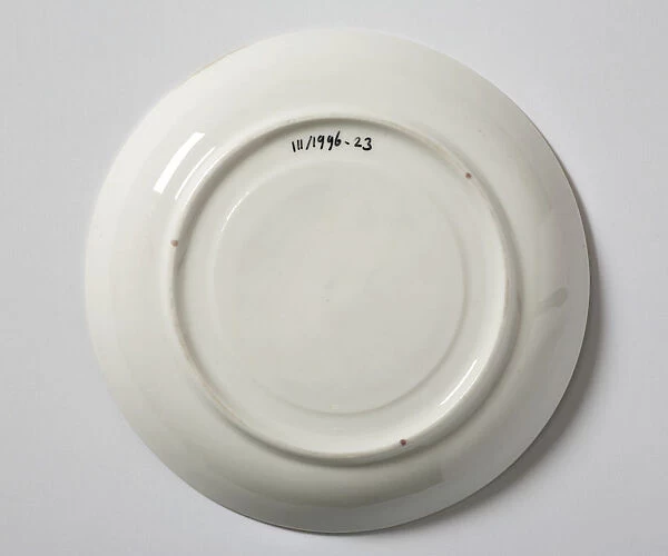 Saucer made from glazed hard-paste porcelain, decorated with a transfer-printed