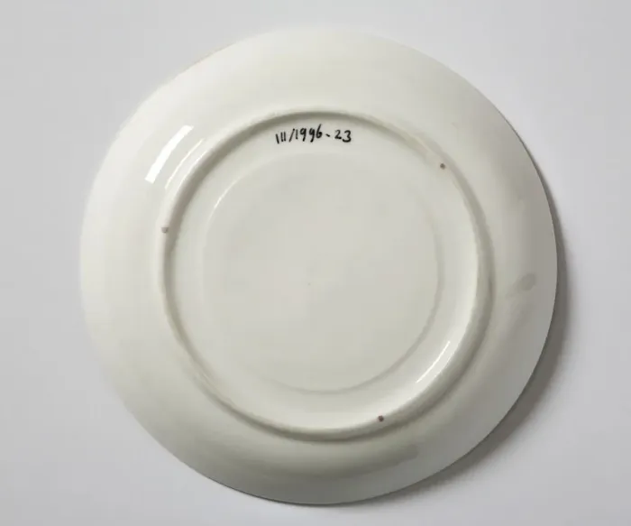 Framed Print : Saucer made from glazed hard-paste porcelain, decorated with a transfer-printed Framed Print : Saucer made from glazed hard-paste porcelain, decorated with a transfer-printed