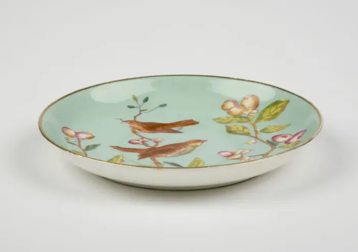 Framed Print : Saucer made from glazed hard-paste porcelain, decorated with a transfer-printed Framed Print : Saucer made from glazed hard-paste porcelain, decorated with a transfer-printed