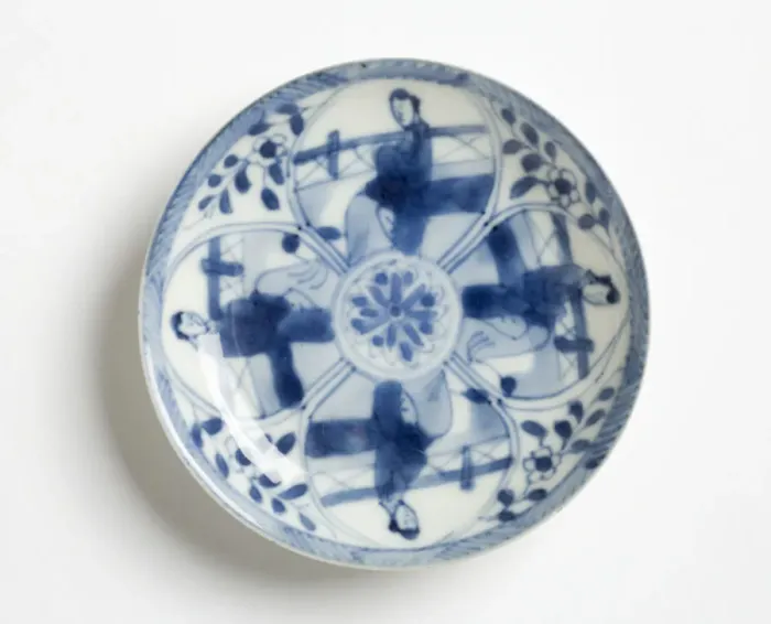 Framed Print : Saucer. Porcelain saucer decorated in underglaze blue with four petal-shaped Framed Print : Saucer. Porcelain saucer decorated in underglaze blue with four petal-shaped