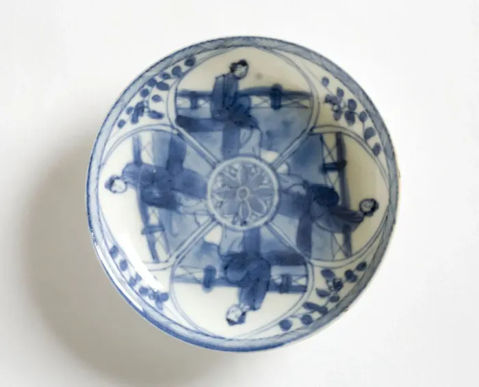 Framed Print : Saucer. Porcelain saucer decorated in underglaze blue with four petal-shaped Framed Print : Saucer. Porcelain saucer decorated in underglaze blue with four petal-shaped