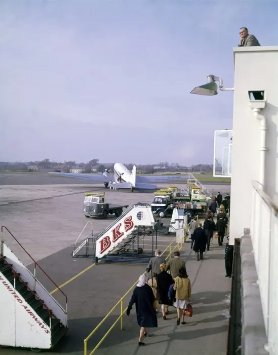 Framed Print : Scene at an airport, with passengers and aircraft Framed Print : Scene at an airport, with passengers and aircraft