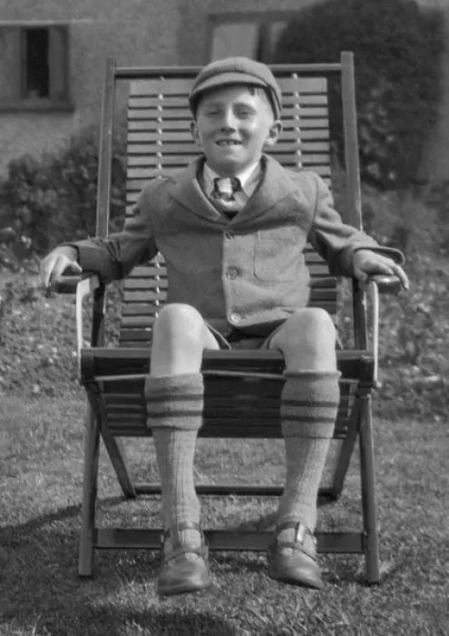 Framed Print : Schoolboy sitting in a garden chair Framed Print : Schoolboy sitting in a garden chair