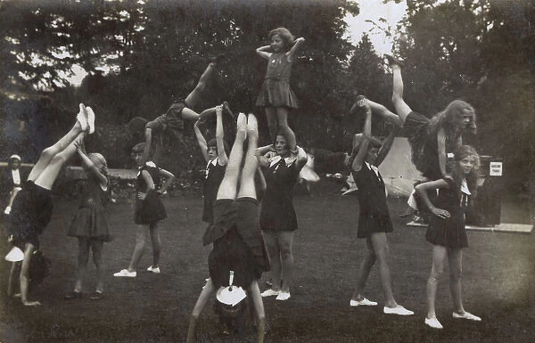 Schoolgirls practising gymnastics