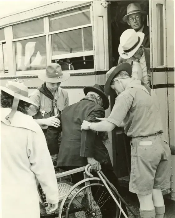 Framed Print : Scouts helping elderly man Framed Print : Scouts helping elderly man