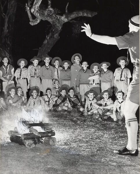 Scouts singing round a campfire, Australia