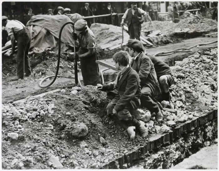 Framed Print : Three scruffy boys watch the men digging up the road in Piccadilly Framed Print : Three scruffy boys watch the men digging up the road in Piccadilly