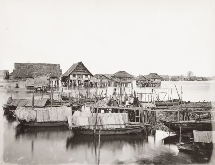Framed Print : SE Asia, probably Malay peninsula, villages houses on stilts, rive boats Framed Print : SE Asia, probably Malay peninsula, villages houses on stilts, rive boats