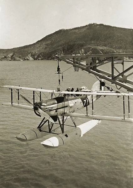 Seaplane hanging from a crane