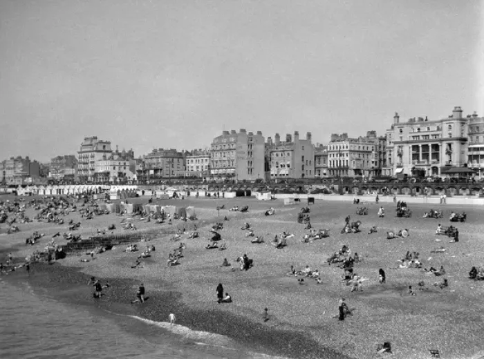 Framed Print : Seaside resort with hotels, beach huts and holidaymakers Framed Print : Seaside resort with hotels, beach huts and holidaymakers