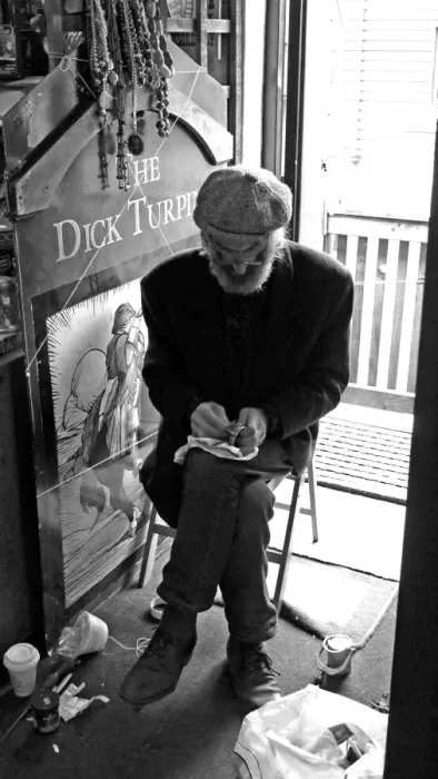 Framed Print : Seated artisan working on an object, England Framed Print : Seated artisan working on an object, England