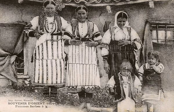 Serbian women and children in traditional costume