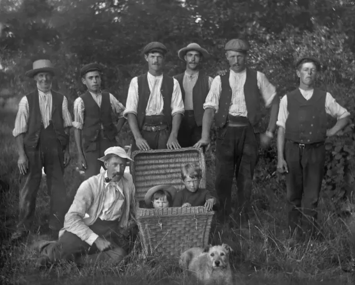 Framed Print : Seven men, two children in a basket, and a dog Framed Print : Seven men, two children in a basket, and a dog