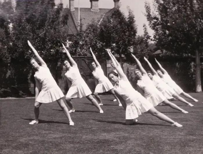 Framed Print : Seven perform stretches in garden Framed Print : Seven perform stretches in garden