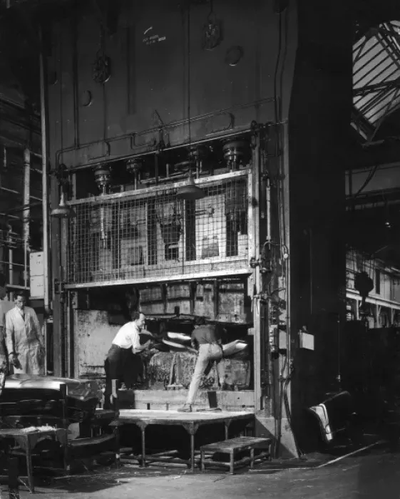 Framed Print : Shaping metal plate in a large hydraulic press Framed Print : Shaping metal plate in a large hydraulic press