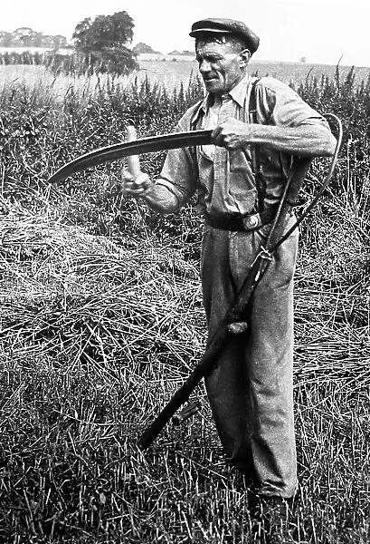 Sharpening his scythe, early 1900s