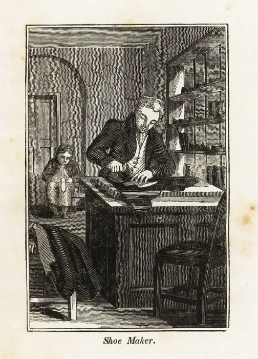 Framed Print : Shoe-maker cutting leather at a table in a shop Framed Print : Shoe-maker cutting leather at a table in a shop