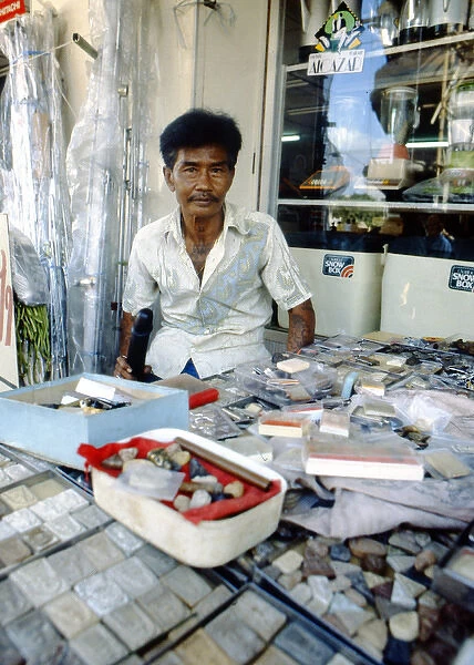 Shopkeeper with his wares, Thailand
