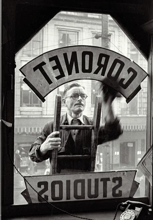 Framed Print : Shot from inside Portrait studio of man cleaning studio window sign, Haymarket, Sheffield Date: 1948 - 1950 Framed Print : Shot from inside Portrait studio of man cleaning studio window sign, Haymarket, Sheffield Date: 1948 - 1950