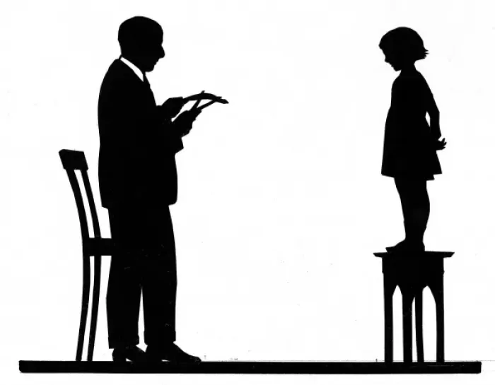 Framed Print : Silhouette artist cutting a childs portrait Framed Print : Silhouette artist cutting a childs portrait