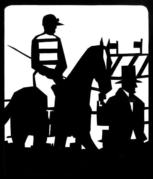 Silhouette of jockey on horseback at races