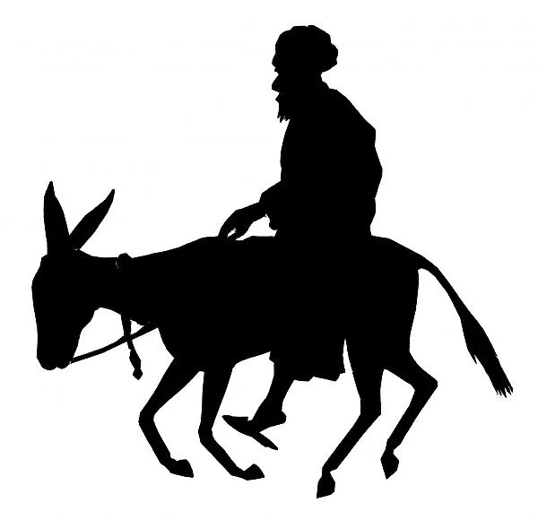 Silhouette of a man riding a donkey