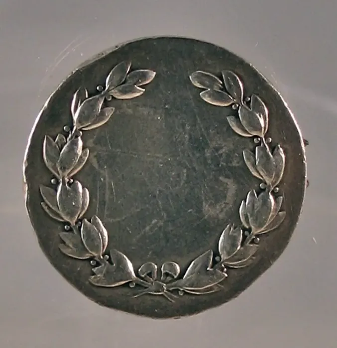 Framed Print : Silver award medal made into a brooch Framed Print : Silver award medal made into a brooch