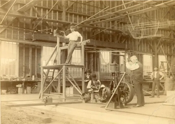 Framed Print : Sir Hiram Maxim operating the valve of the steam engine?