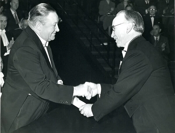 Sir Roy Dobson, CBE, left, is presented with his certifi?