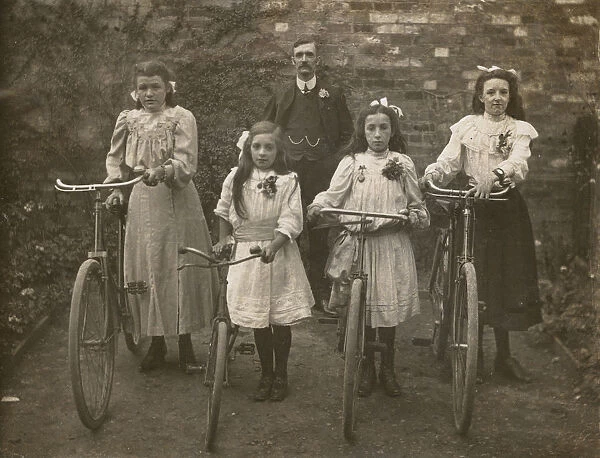 Four Sisters stand proudly with their bicycles