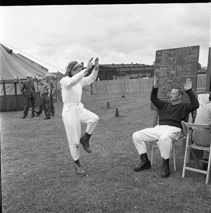 : Sky diver practising in a field : Sky diver practising in a field