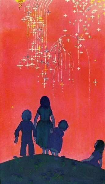 Sky rockets. A group of children stand on a hill top watching a dazzling