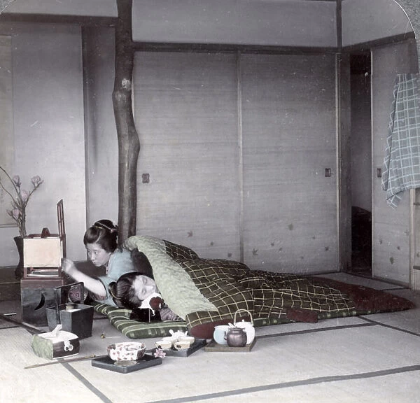Sleeping under an eiderdown, Japan, c. 1900