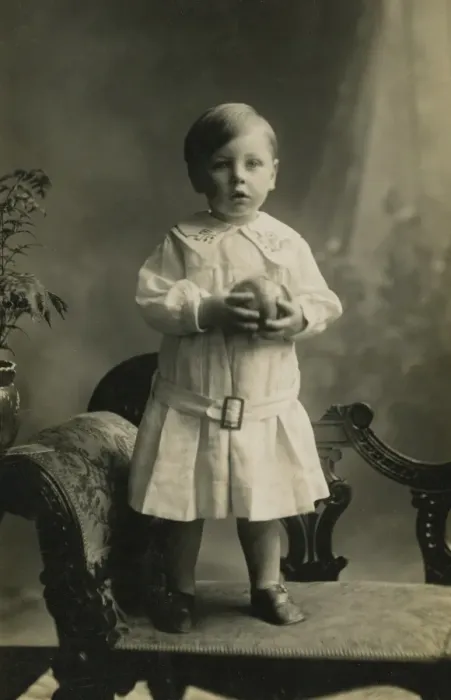 Framed Print : Small boy standing on chaise-longue Framed Print : Small boy standing on chaise-longue