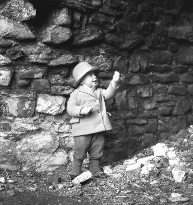 Framed Print : Small boy in front of a wall Framed Print : Small boy in front of a wall