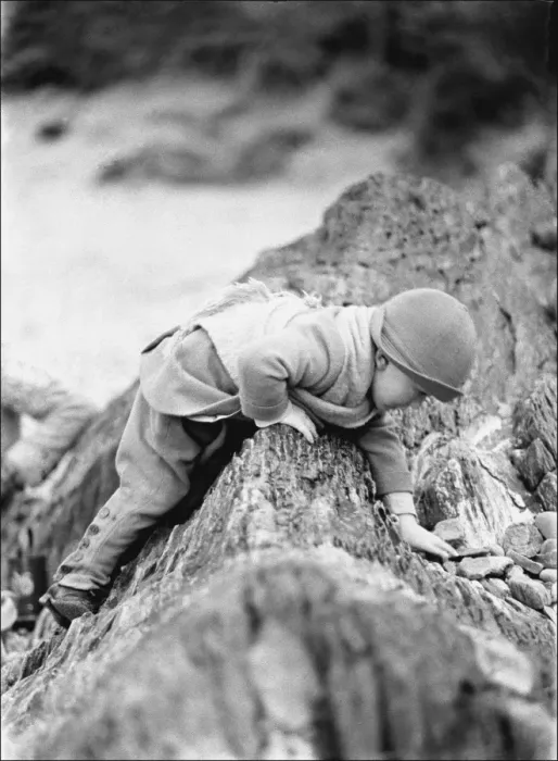 Framed Print : Small toddler playing on seaside rocks, Devon Framed Print : Small toddler playing on seaside rocks, Devon