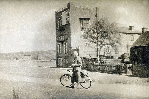 A smart gentleman out for a cycle - an unidentified location