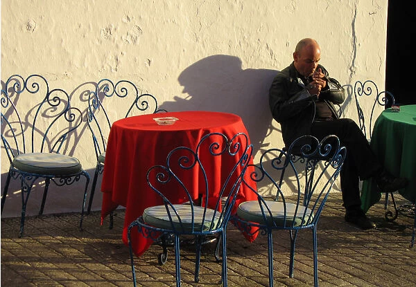Smoker outside cafe, Mijas, Spain