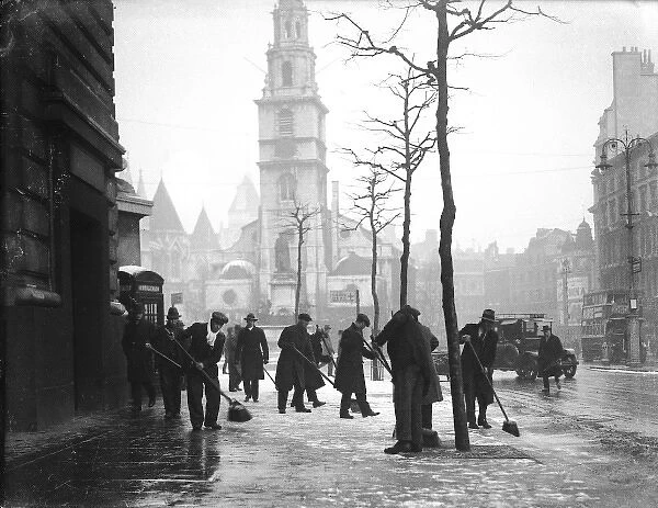 Snow Sweepers 1930S. Men sweeping snow from the pavements in central London