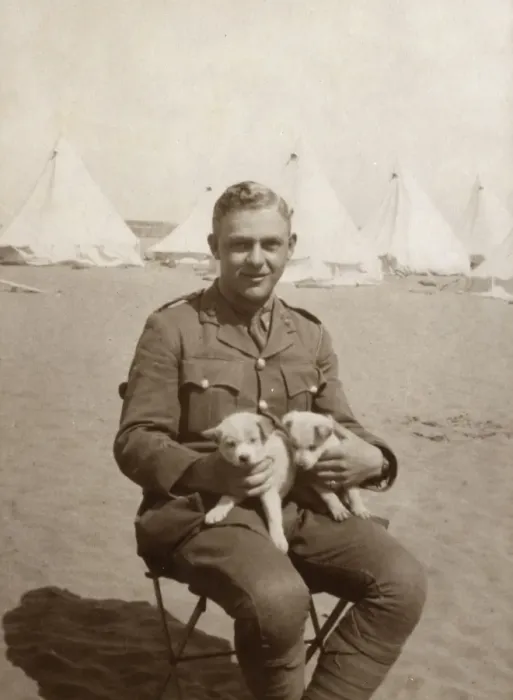 Framed Print : Soldier at camp holding two puppies, WW1 Framed Print : Soldier at camp holding two puppies, WW1