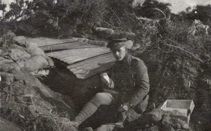 Framed Print : Soldier sitting by a dugout, Northern France, WW1 Framed Print : Soldier sitting by a dugout, Northern France, WW1