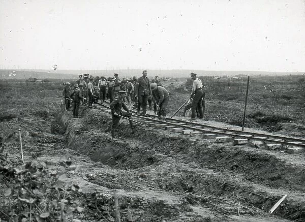Soldiers building a battlefield railway track