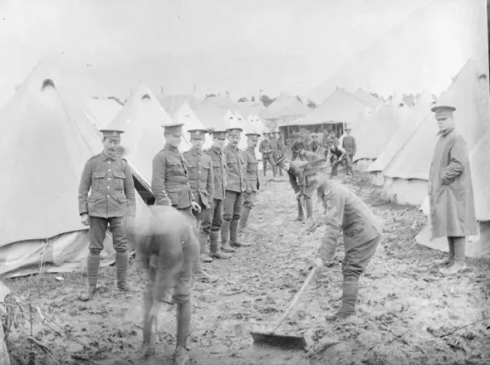 Framed Print : Soldiers cleaning up at a muddy training camp Framed Print : Soldiers cleaning up at a muddy training camp