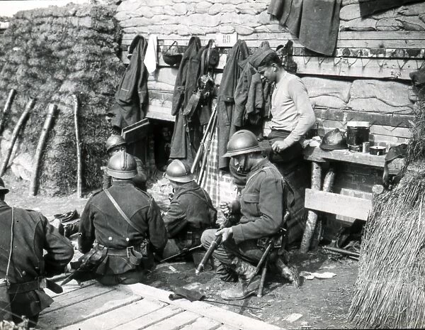 Soldiers cleaning their weapons